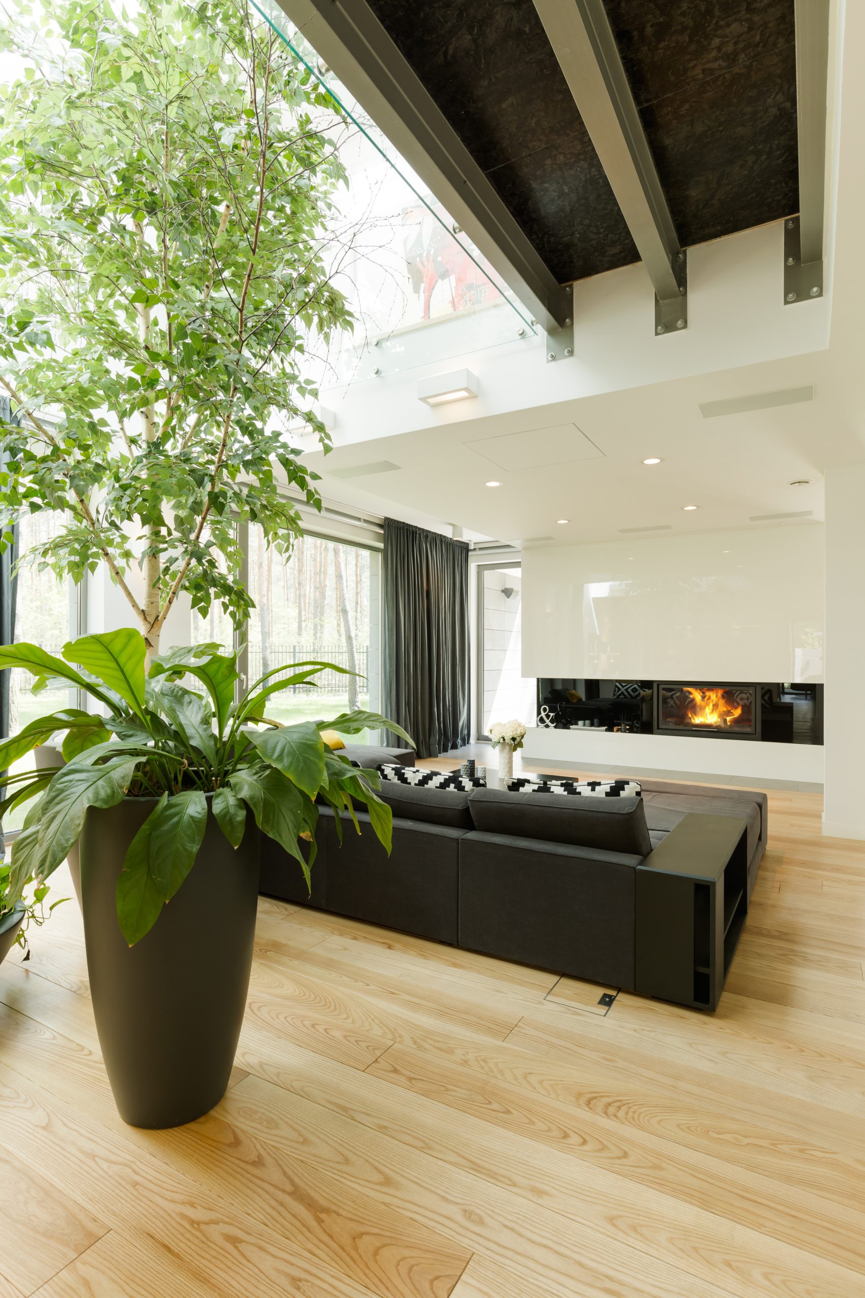 Spacious and modern living room with sofa and fireplace